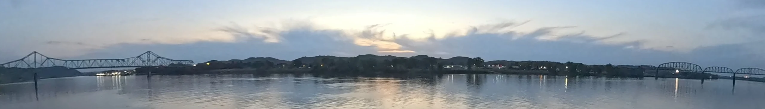 Panoramic view across the Ohio River showing bridges near Point Pleasant, West Virginia, and Gallipolis, Ohio at dusk
